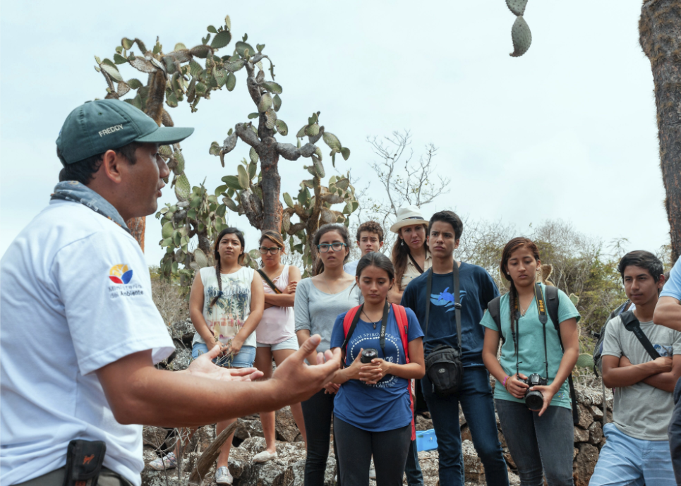 Figure 6. Students learn about giant tortoises at the Fausto Llerena Breeding Center. Photo: Diego Bermeo