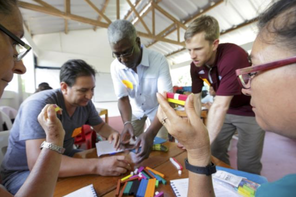 Figure 3. Dr. Arthur Powell, one of the program’s external facilitators, instructs teachers in the use of Cuisenaire rods, which are an excellent way to apply manipulatives for developing understanding of mathematical concepts. Photo: Jonathan Drake/T2T-Global.